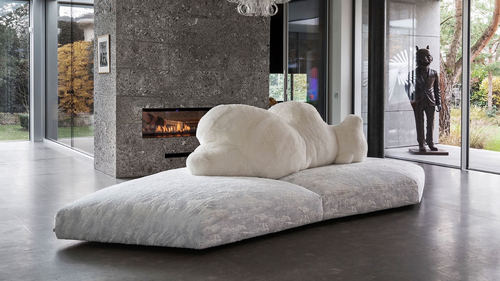   Pack . in front of the chimneypiece covered in Ceppo del Gr&eacute; stone 